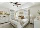 Spacious main bedroom with a tray ceiling, barn door access, and neutral color scheme at 540 Castle Hall Rd, Mount Pleasant, SC 29464