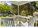 Charming porch with rocking chairs and a view of the landscaped front yard at 540 Castle Hall Rd, Mount Pleasant, SC 29464