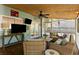 Spacious screened porch with comfortable seating, a ceiling fan, and televisions, perfect for entertaining guests at 540 Castle Hall Rd, Mount Pleasant, SC 29464