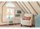 Cozy attic space with white walls, exposed beams, and comfortable seating at 55 Laurens St # 55-A, Charleston, SC 29401