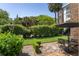 Patio with table surrounded by greenery and trees at 55 Laurens St # 55-A, Charleston, SC 29401