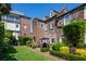 Charming backyard features a brick patio, lush landscaping, and historic brick building at 55 Laurens St # 55-A, Charleston, SC 29401