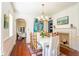 Bright dining room features a fireplace, chandelier, and doorway to another room at 55 Laurens St # 55-A, Charleston, SC 29401