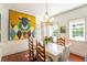 Dining room with hardwood floors and unique wall art at 55 Laurens St # 55-A, Charleston, SC 29401