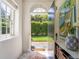 Inviting entryway with an open door, offering glimpses of the garden at 55 Laurens St # 55-A, Charleston, SC 29401
