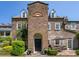 Charming brick home featuring a center tower, symmetrical dormers, and a courtyard with seating at 55 Laurens St # 55-A, Charleston, SC 29401
