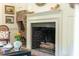 Cozy living room featuring a fireplace with exposed brick and stylish decor at 55 Laurens St # 55-A, Charleston, SC 29401