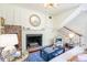 Charming living room boasting a fireplace with decorative accents and wood floors at 55 Laurens St # 55-A, Charleston, SC 29401