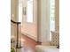 Hallway with a wood floor, white walls, and view of a staircase at 55 Laurens St # 55-A, Charleston, SC 29401