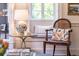 Living room featuring a window seat, a lamp, hardwood floors and stylish decor at 55 Laurens St # 55-A, Charleston, SC 29401