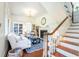 Bright living room with wood floors and staircase with a fireplace at 55 Laurens St # 55-A, Charleston, SC 29401