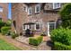 Brick patio with outdoor dining surrounded by lush greenery at 55 Laurens St # 55-A, Charleston, SC 29401