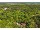 Expansive aerial view of lush green forest, showcasing a home nestled among the trees and landscaping at 5680 Dixie Plantation Rd, Hollywood, SC 29449