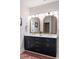 Elegant bathroom featuring double sinks, modern fixtures, and ample counter space at 5680 Dixie Plantation Rd, Hollywood, SC 29449