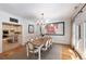 Dining room featuring a decorative chandelier, a table with seating for eight, and doors to the yard at 5680 Dixie Plantation Rd, Hollywood, SC 29449