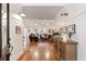 Spacious entryway with hardwood floors, leading to a living room with comfortable seating and stylish decor at 5680 Dixie Plantation Rd, Hollywood, SC 29449