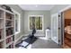 Bright exercise room with rowing machine, natural light, and a view of the outdoors at 5680 Dixie Plantation Rd, Hollywood, SC 29449