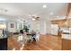 Spacious living area with hardwood floors, seamlessly connecting to the kitchen for easy entertaining at 5680 Dixie Plantation Rd, Hollywood, SC 29449