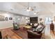 Spacious living room with hardwood floors, ceiling fans, and comfortable leather sofas at 5680 Dixie Plantation Rd, Hollywood, SC 29449