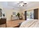 Comfortable main bedroom featuring hardwood floors, a dresser, and a relaxed ambiance at 5680 Dixie Plantation Rd, Hollywood, SC 29449
