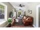 Bright and airy sitting room with comfortable seating, a TV, and natural light at 5680 Dixie Plantation Rd, Hollywood, SC 29449