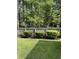 Green backyard featuring a wooden fence at 5691 Captain Kidd Rd, Hollywood, SC 29449