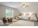 Comfortable bedroom featuring three twin beds and a seating area with soft lighting at 5691 Captain Kidd Rd, Hollywood, SC 29449
