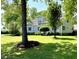 Inviting home with manicured lawn and lush landscaping, offering great curb appeal and a welcoming atmosphere at 5691 Captain Kidd Rd, Hollywood, SC 29449