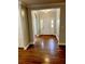 Elegant foyer with gleaming hardwood floors, a grand entrance, and neutral walls, creating a welcoming first impression at 5691 Captain Kidd Rd, Hollywood, SC 29449