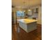 Stylish kitchen with a large island, stainless steel appliances, pendant lighting, and ample cabinet space at 5691 Captain Kidd Rd, Hollywood, SC 29449