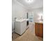 Well-equipped laundry room with modern washer and dryer units and counter space at 5691 Captain Kidd Rd, Hollywood, SC 29449
