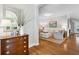 Bright and inviting living room featuring hardwood floors, neutral décor, and ample natural light, creating a comfortable space at 5691 Captain Kidd Rd, Hollywood, SC 29449