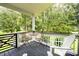 Tranquil porch with a metal table and chairs at 5691 Captain Kidd Rd, Hollywood, SC 29449