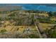 Scenic aerial view of a coastal property with a home nestled among trees near a waterway at 6440 St Anthony Dr, Hollywood, SC 29449