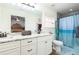 Bright bathroom features granite countertops, white cabinets and shower/tub combo at 6440 St Anthony Dr, Hollywood, SC 29449