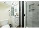 Modern bathroom with granite countertop vanity and glass door shower with gray tile at 6440 St Anthony Dr, Hollywood, SC 29449
