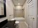 A bathroom with a bathtub-shower combination and a granite vanity at 6440 St Anthony Dr, Hollywood, SC 29449