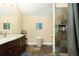 This updated bathroom boasts stylish slate flooring, a modern vanity, and a tiled shower at 6440 St Anthony Dr, Hollywood, SC 29449