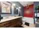 The updated bathroom features a double sink vanity and a luxurious soaking tub at 6440 St Anthony Dr, Hollywood, SC 29449