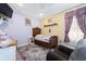 A charming bedroom with a unique antique bed, colorful rug and decor at 6440 St Anthony Dr, Hollywood, SC 29449