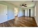 This bedroom features hardwood floors, blue walls, and 2 closet doors at 6440 St Anthony Dr, Hollywood, SC 29449