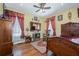 This bedroom has hardwood floors, unique decorations, and a comfortable rocking chair at 6440 St Anthony Dr, Hollywood, SC 29449