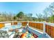 Outdoor deck with a seating area featuring a glass table, chairs, and a colorful rug, perfect for relaxing at 6440 St Anthony Dr, Hollywood, SC 29449