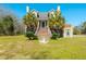 Charming exterior of a home with a stone foundation, inviting staircase, and beautifully landscaped front yard at 6440 St Anthony Dr, Hollywood, SC 29449