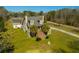 Exterior of a charming home with two stories, a stone facade, manicured landscaping, and a welcoming entrance at 6440 St Anthony Dr, Hollywood, SC 29449