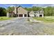 Exterior of a two-story home featuring a two-car garage and a spacious driveway with ample parking at 6440 St Anthony Dr, Hollywood, SC 29449