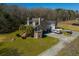 A well-maintained exterior of a multi-story home with stone base and landscaped front yard on a sunny day at 6440 St Anthony Dr, Hollywood, SC 29449