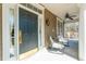 Inviting front porch featuring a ceiling fan and seating area with rocking chairs at 6440 St Anthony Dr, Hollywood, SC 29449