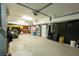 Spacious garage with high ceilings, storage, and room for multiple vehicles at 6440 St Anthony Dr, Hollywood, SC 29449