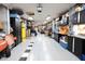 Organized garage with ample storage cabinets, workspace, and checkered accent on the floor at 6440 St Anthony Dr, Hollywood, SC 29449